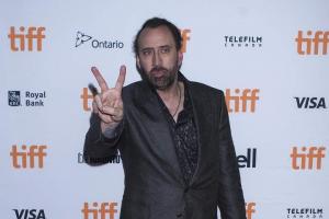 Nicolas Cage spotted holding hands with mystery 'girlfriend'