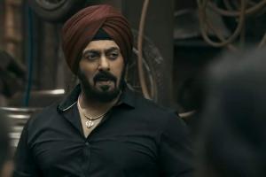 Salman Khan drives an auto-rickshaw on a busy street